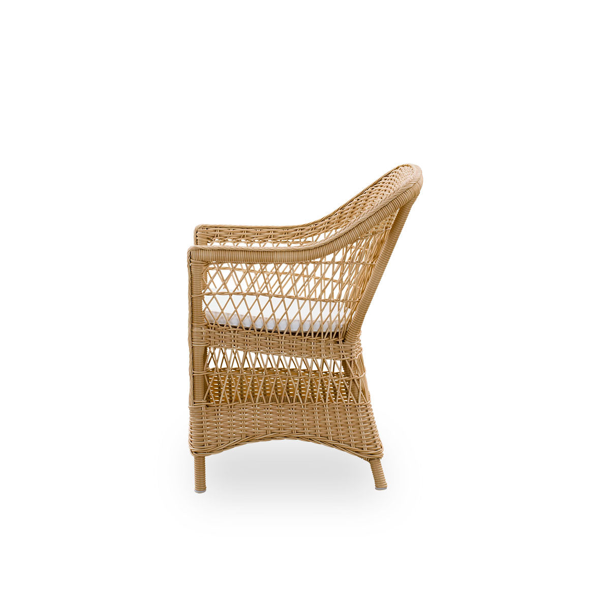 Plain side view of the Charlot Exterior dining chair in a natural color, a fully woven outdoor chair in British colonial style handcrafted from ArtFibre on durable aluminum frames.