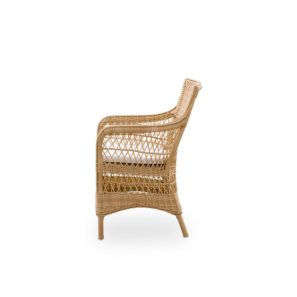 Plain side view of Marie outdoor dining chair with armrests presented in Natural color. Aluminum frame fully woven with ArtFibre inspired by British colonial style.