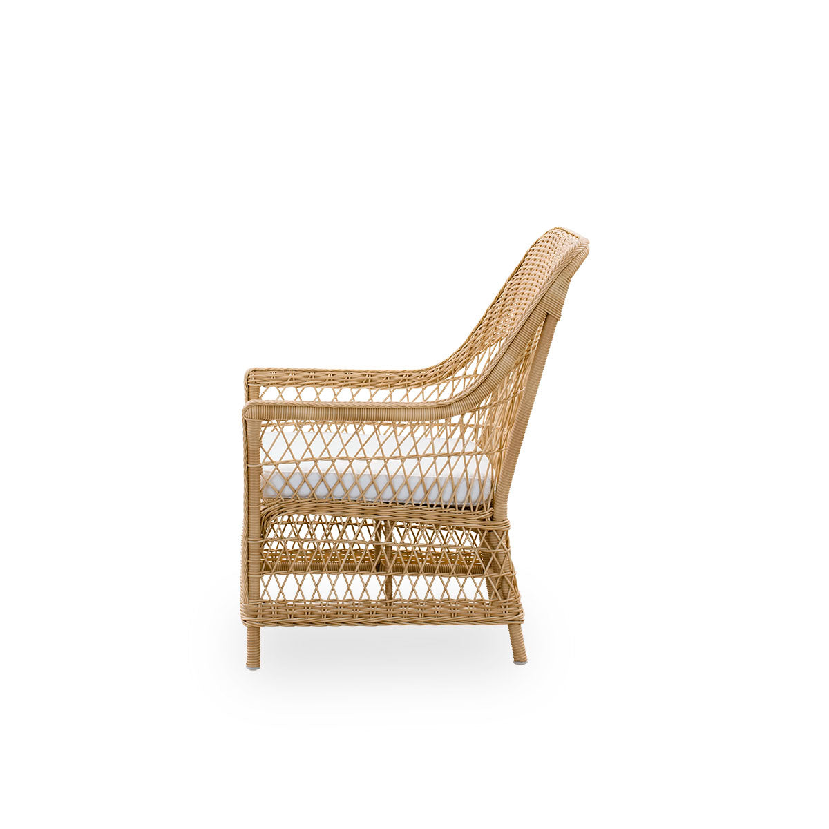 Plain side view of the Dawn outdoor lounge chair in natural color, inspired by British colonial style. Romantic lounge chair with armrest and a high backrest. Fully woven ArtFibre on hand-bent aluminum frame.
