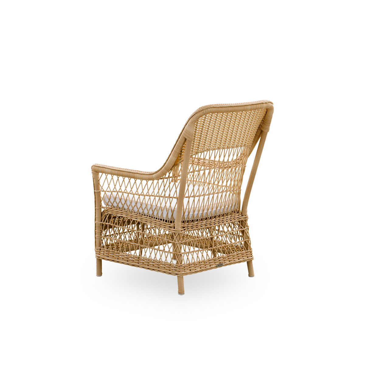 Plain back view of the Dawn outdoor lounge chair in natural color, inspired by British colonial style. Romantic lounge chair with armrest and a high backrest. Fully woven ArtFibre on hand-bent aluminum frame.