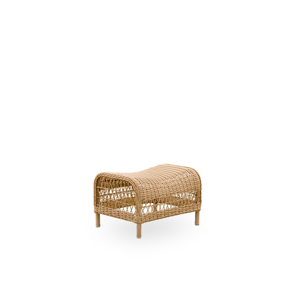 Side view of the Dawn Exterior footstool in natural color, inspired by British colonial style. Fully woven footstool handcrafted from ArtFibre on durable aluminum frames.