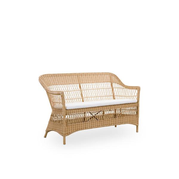 Side view of the Charlot 2-seater Exterior sofa in natural color, an fully woven outdor sofa in British colonial style, handcrafted from ArtFibre on durable aluminum frames.