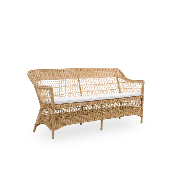 Side view of the Charlot 3-seater Exterior sofa in natural color, an fully woven outdor sofa in British colonial style, handcrafted from ArtFibre on durable aluminum frames.