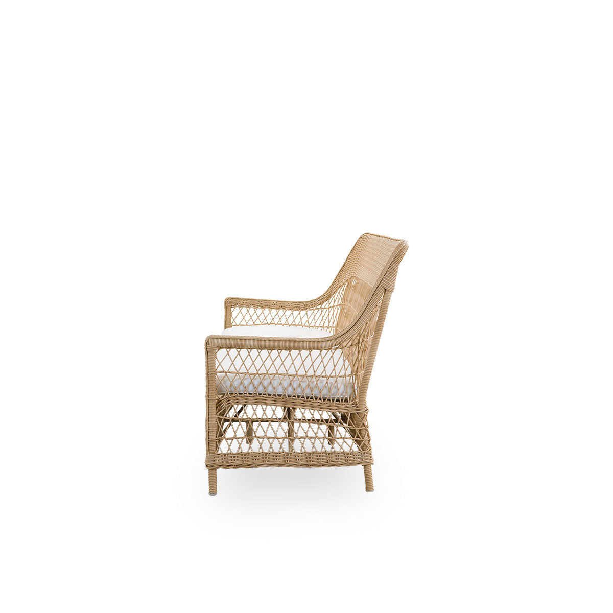 Plain side view of the Dawn outdoor 3-seater sofa in natural color, inspired by British colonial style. Romantic sofa with armrest and a high backrest. Fully woven ArtFibre on hand-bent aluminum frame.