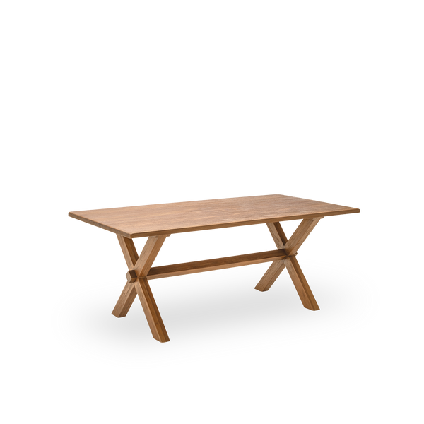 Side view of the Hugo dining table, 180x90 cm, in teak with a natural, patinated surface. Surface treated to bring out the natural grain of the wood, seating six. Made from teak certified as Indonesian Legal Wood.