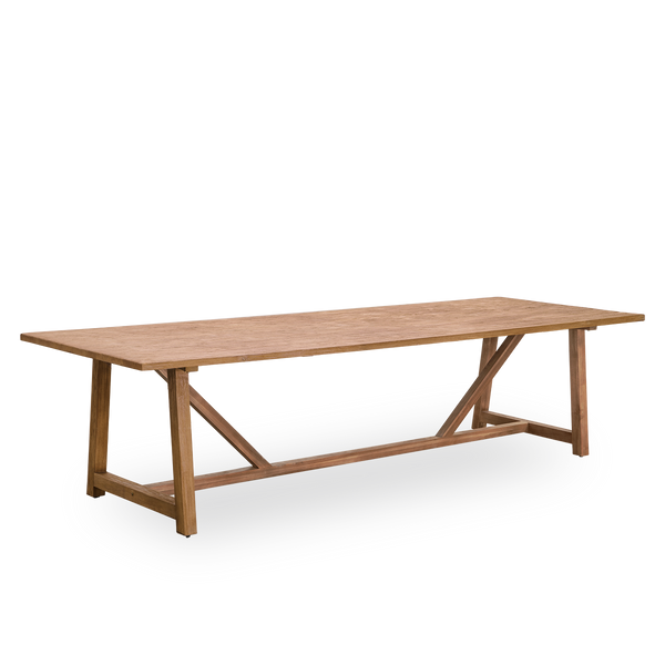 Side view of Lucas indoor dining table in patinated teak with a rustic, exclusive look in natural chestnut color. Size 300x100 cm for 10 persons.