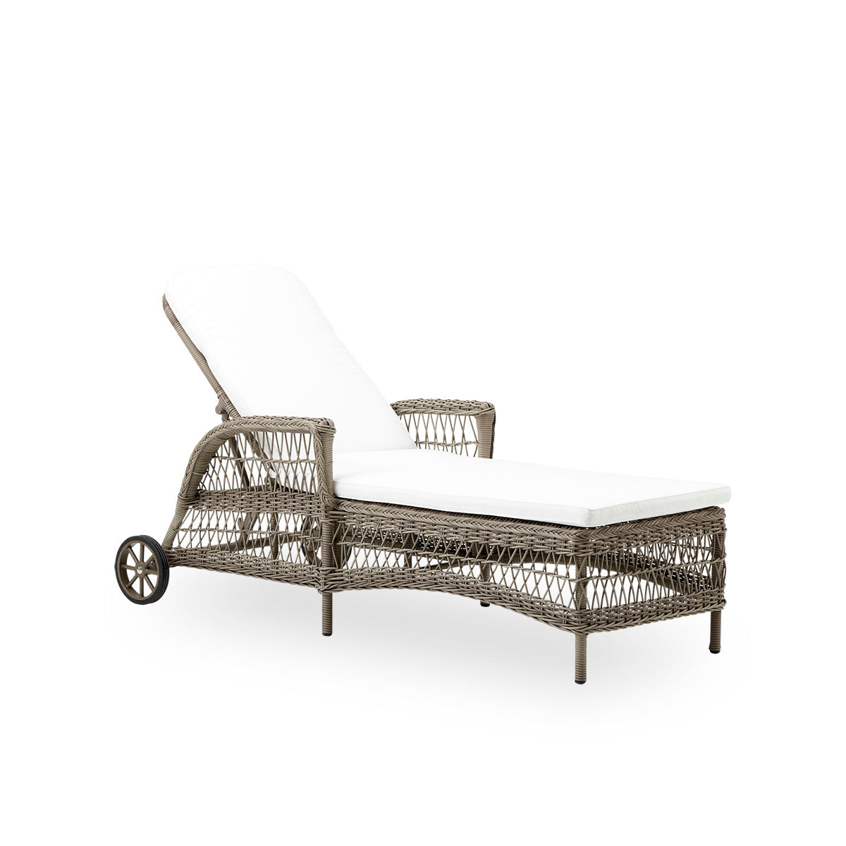 Side view of the Daisy sunbed in antique grey. Fully woven sunbed with adjustable backrest and wheels, inspired by British colonial style. Aluminum frame woven with ArtFibre.
