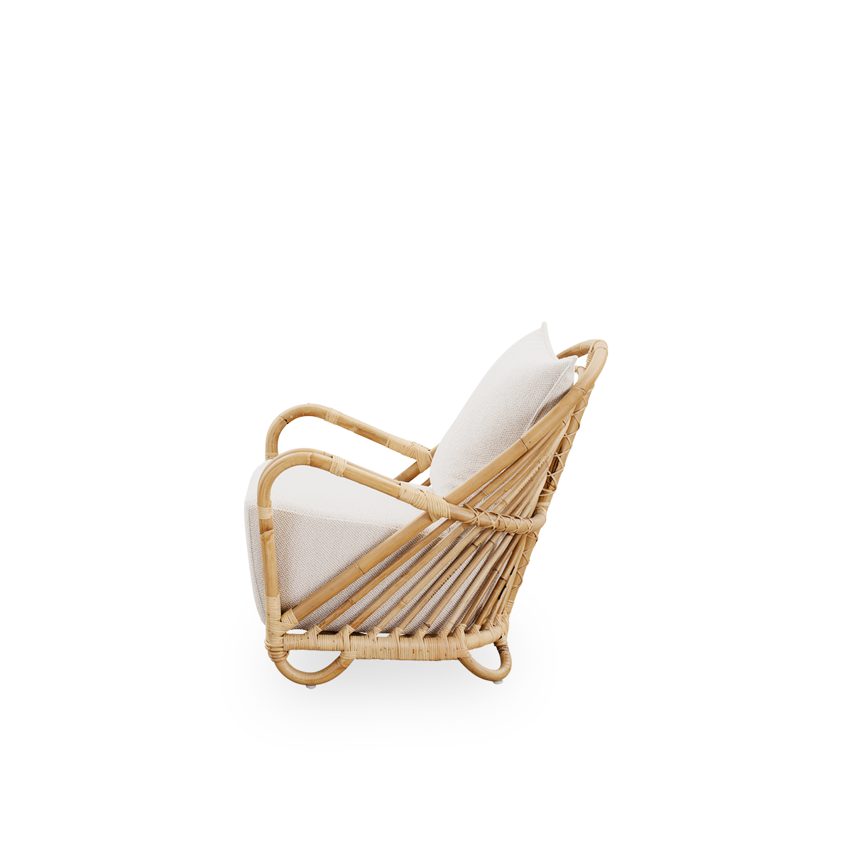 Plain side view of the Charlottenborg Lounge Chair in polished natural rattan, designed by Arne Jacobsen. The chair features a curved back and armrests integrated into the base, handcrafted from high quality Indonesian rattan.