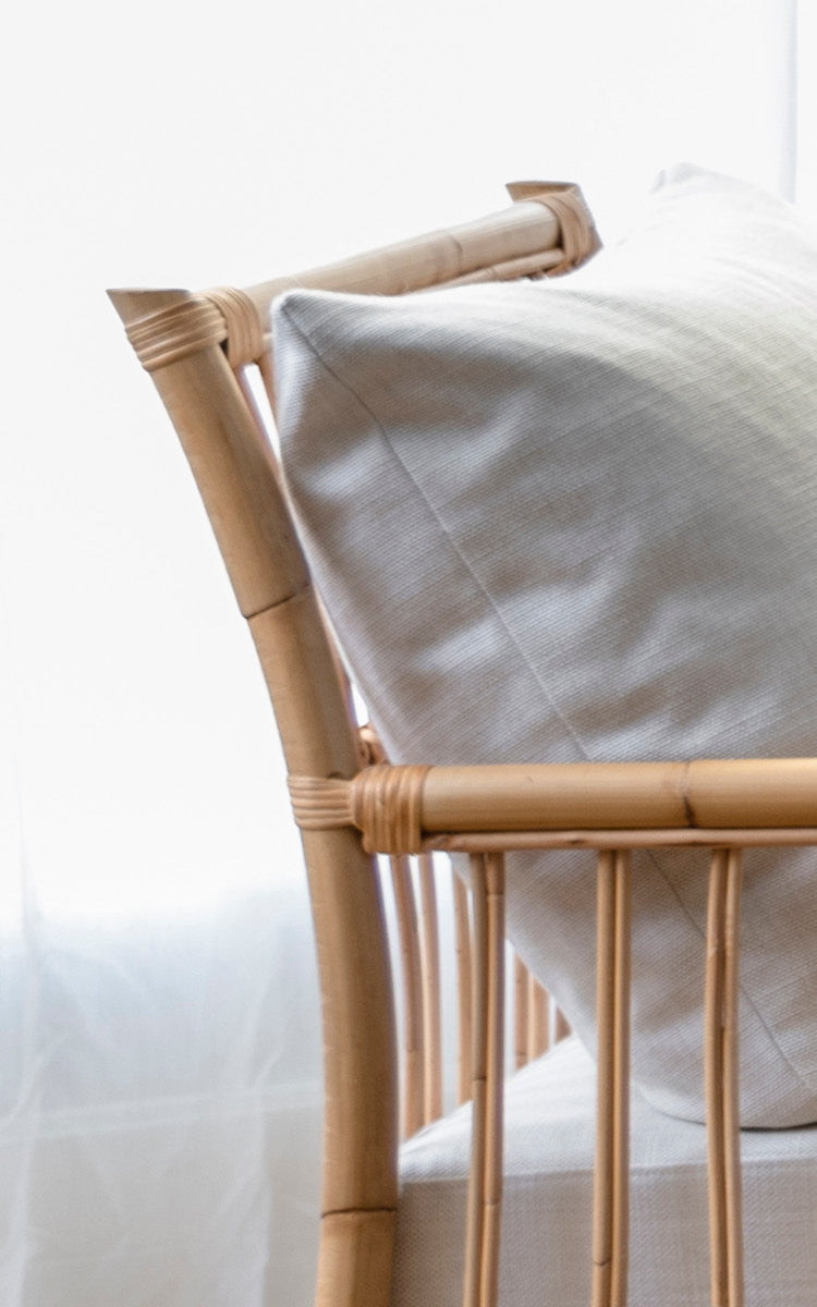 This is a close-up image of Caroline Lounge Chair in natural rattan.