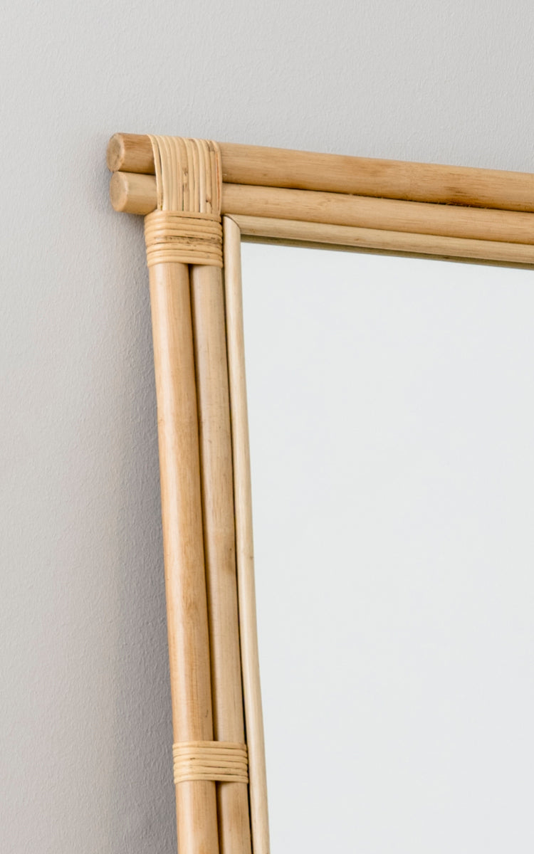 This is a close-up image of Rasmus Mirror 172 cm in natural rattan. Detail of the natural rattan rod frame and wrapped corner joints.