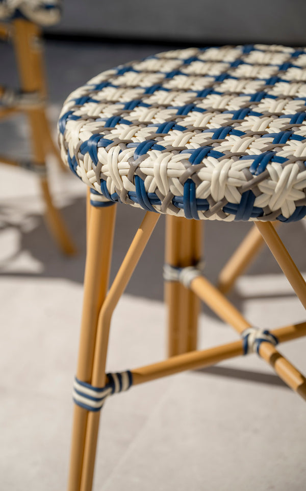 This is a close-up image of Simone Exterior Stool in almond aluminium frame starweave ivory navy blue cappuccino artfibre. Woven seat.