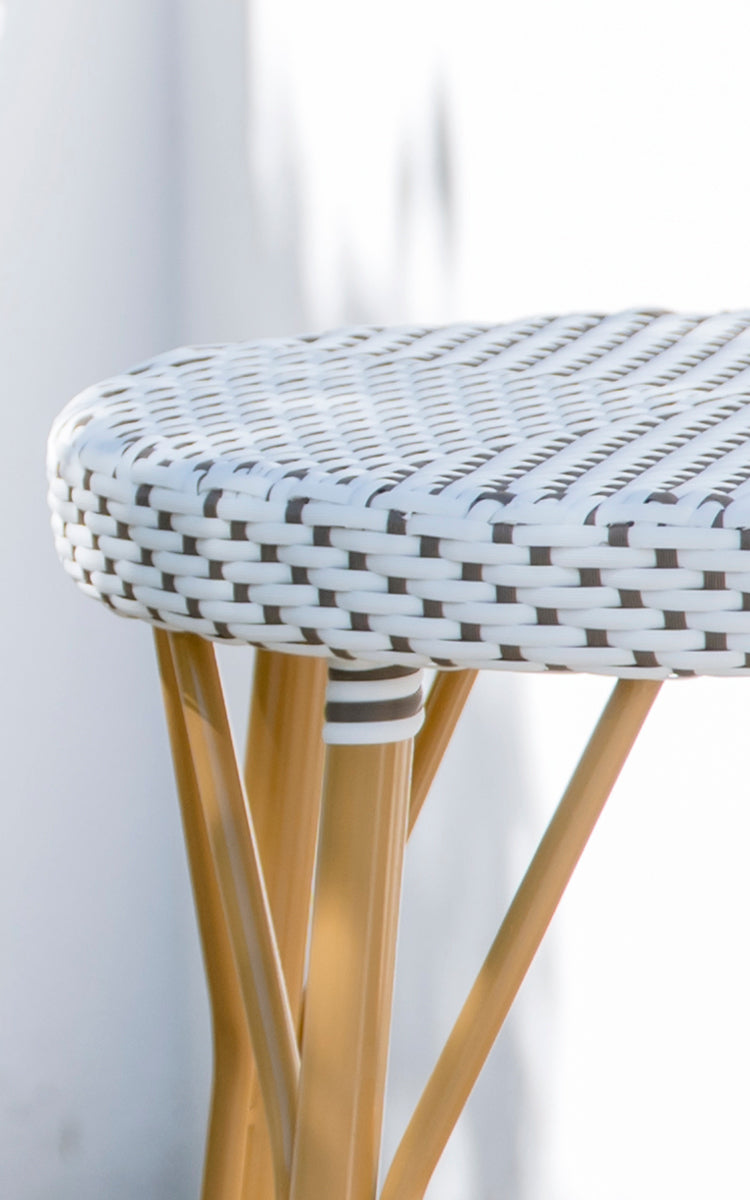 This is a close-up image of Simone Exterior Bar Stool in almond aluminium frame white w cappuccino dot artfibre.