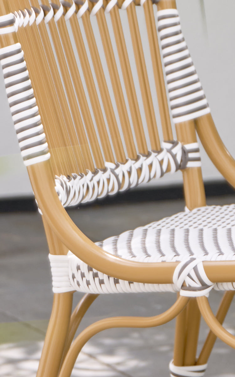 This is a close-up image of Monique Exterior Dining Chair in white w cappuccino dot ArtFibre. Detail of the striped weave pattern.