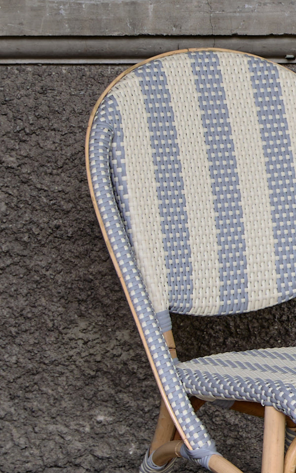 This is a close-up image of Sofie Dining Chair in striped grey ivory artfibre skin on natual rattan frame.