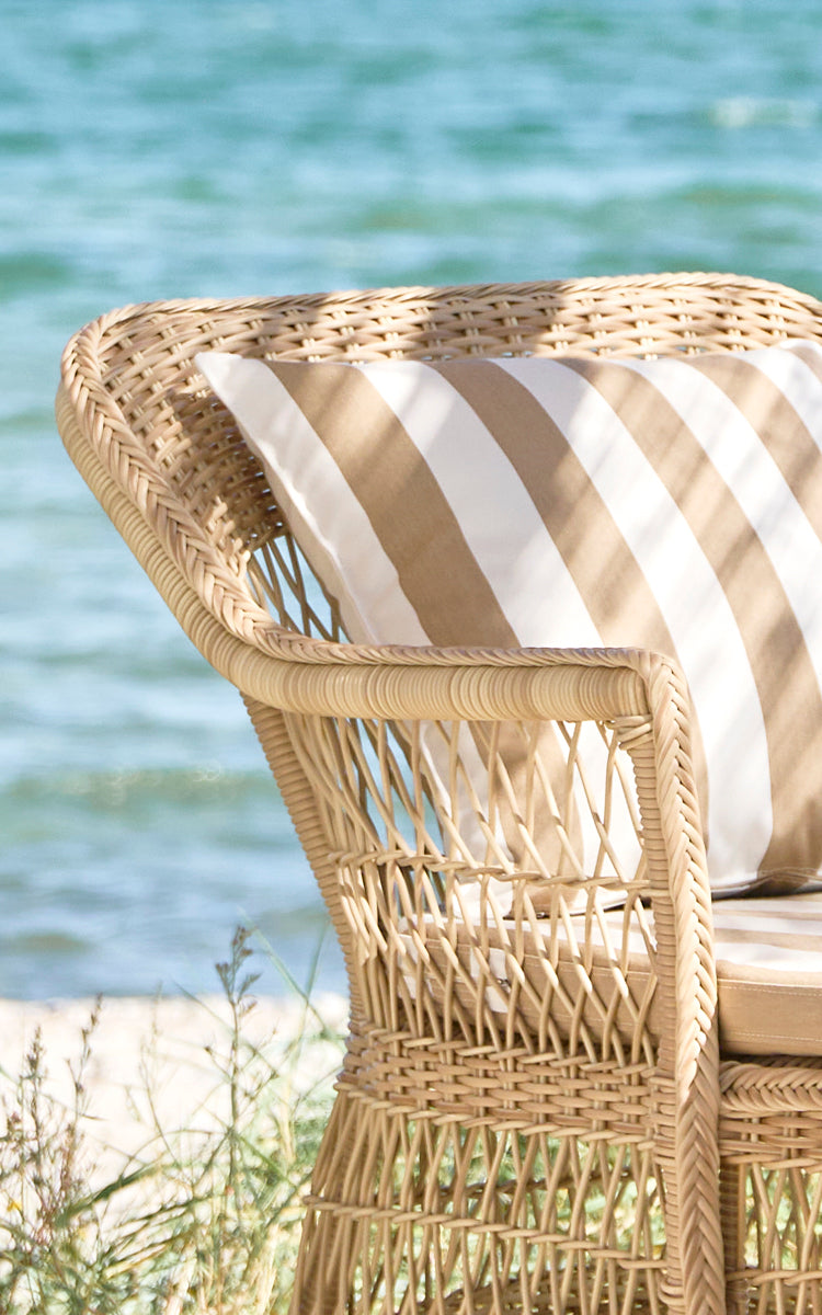 This is a close-up image of Olivia Exterior Sunbed in natural artfibre aluminium. Detail of the diamond weave ArtFibre side panel.