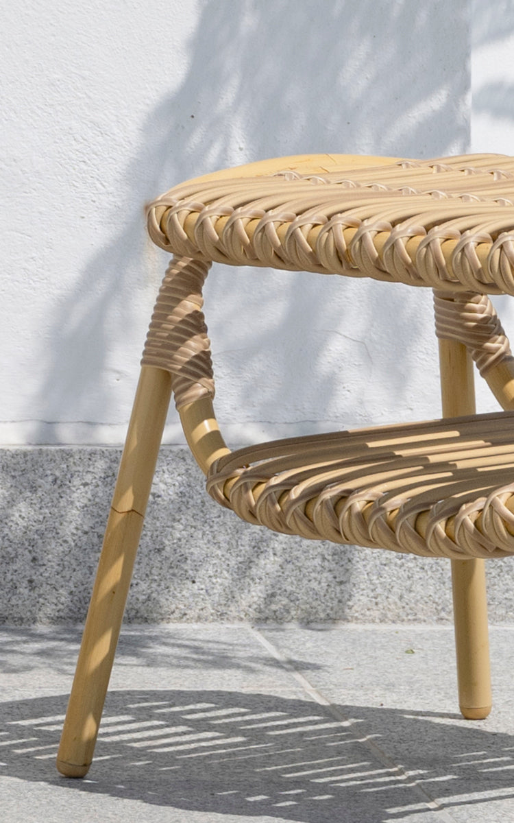 This is a close-up image of Machiya Exterior Stool in natural aluminium artfibre. Braided ArtFibre seat and wrapped joints on outdoor terrace.