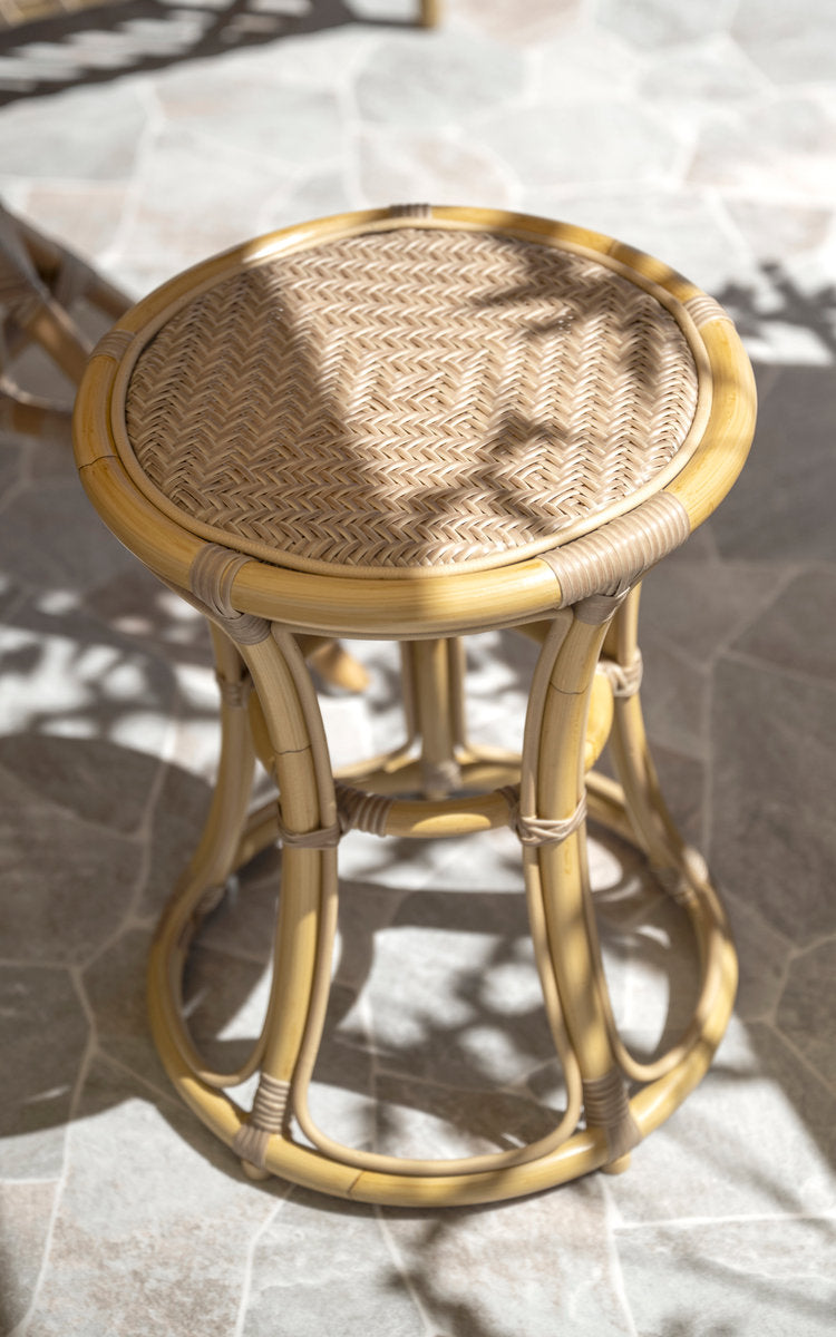 This is a close-up image of Bella Exterior Stool in natural aluminium artfibre. Woven round seat and bent frame.