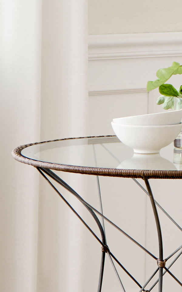 This is a close-up image of Funky Dining Chair in hazelnut rattan iron frame.