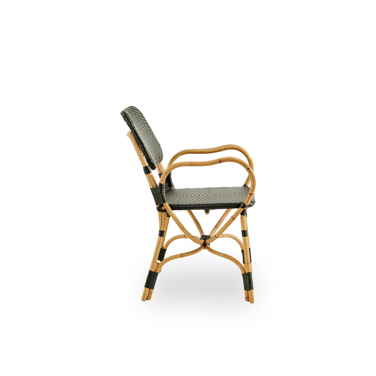 Plain side view of Bistro chair in black ArtFibre weave with elegant design. Rattan frame with seat woven in ArtFibre. The curved Rattan frame under the seat extend into armrests.