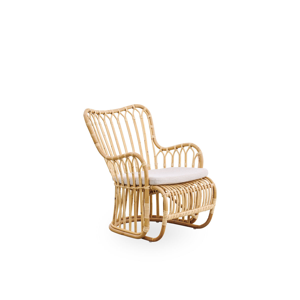 Side view of Tulip lounge chair designed by Tove Kindt-Larsen, with soft organic lines. Handcrafted from high-quality Indonesian rattan