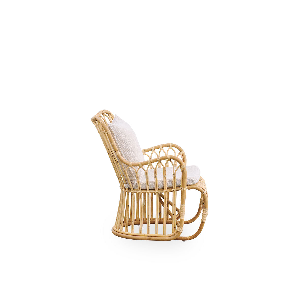 Plain side view of Tulip lounge chair designed by Tove Kindt-Larsen, with soft organic lines. Handcrafted from high-quality Indonesian rattan