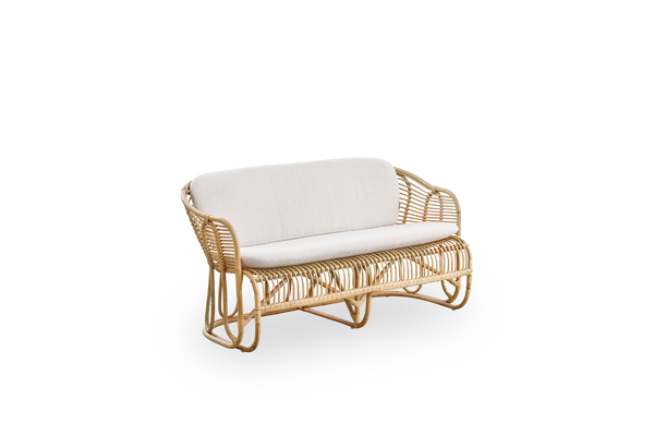 Side view of Swing 2-seater sofa designed by Tove Kindt-Larsen. Handcrafted from high-quality Indonesian rattan and fitted with seat and back cushion.