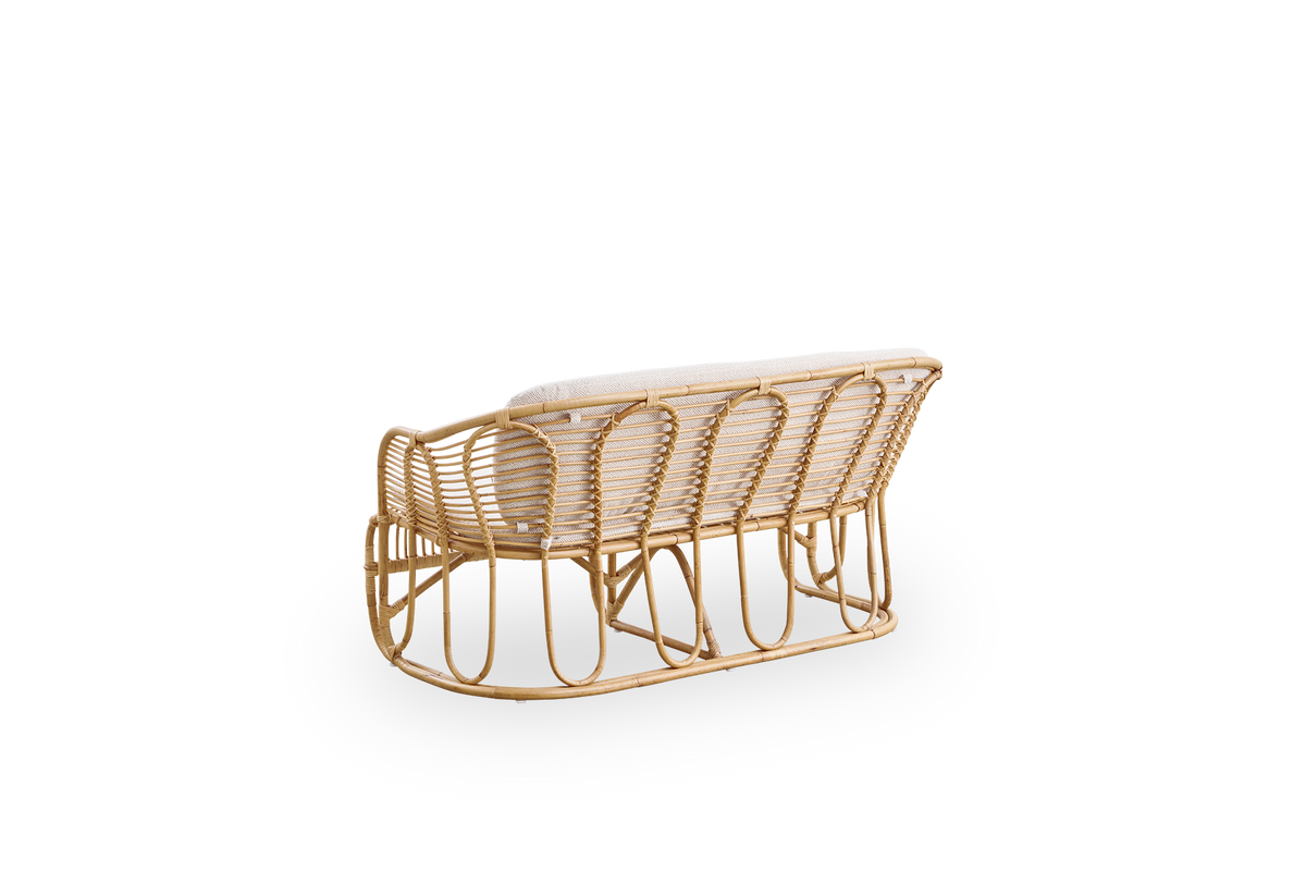 Back side view of the Swing 2-seater sofa designed by Tove Kindt-Larsen.
Handcrafted from high-quality Indonesian rattan and fitted with seat and back cushion.