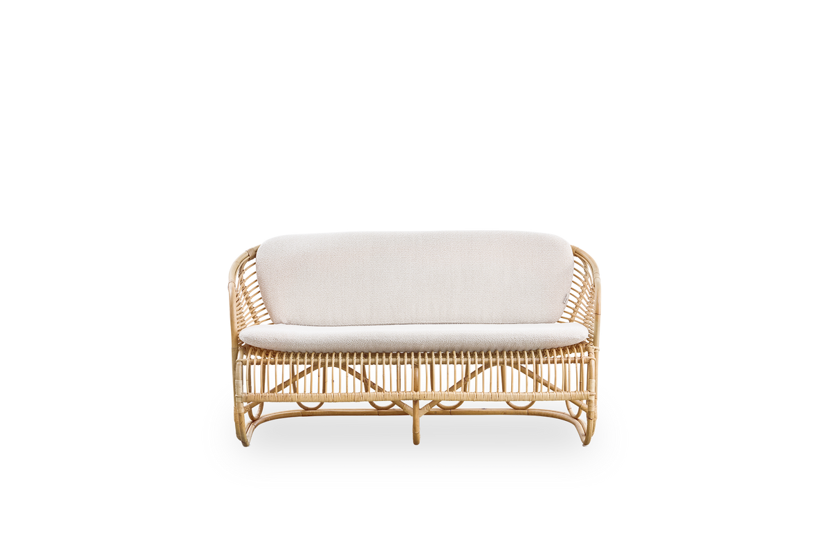 Front view of the Swing 2-seater sofa designed by Tove Kindt-Larsen.
Handcrafted from high-quality Indonesian rattan and fitted with seat and back cushion.