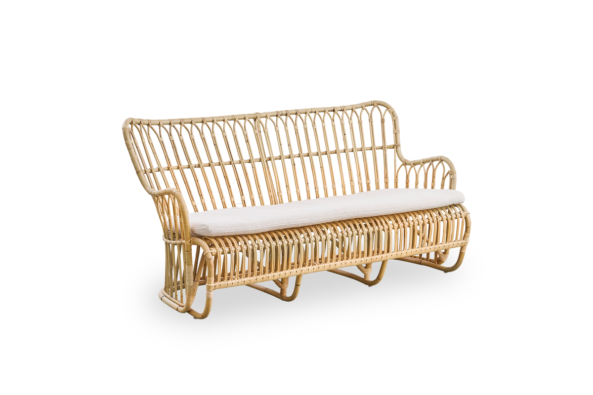 Side view of Tulip wicker sofa designed by Tove Kindt-Larsen, with soft organic lines. Handcrafted from high-quality Indonesian rattan