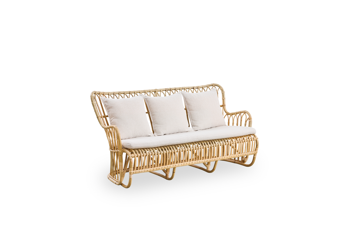 Side view of Tulip wicker sofa designed by Tove Kindt-Larsen, with soft organic lines. Handcrafted from high-quality Indonesian rattan