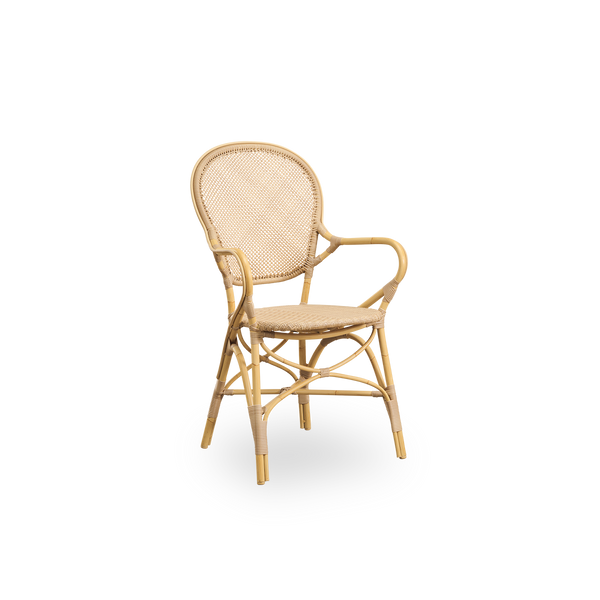 Side view of Rossini outdoor dining armchair in Natural color. Elegant chair with round backrest and armrests in simple design. Aluminium frame in rattan look with woven ArtFibre seat and backrest.