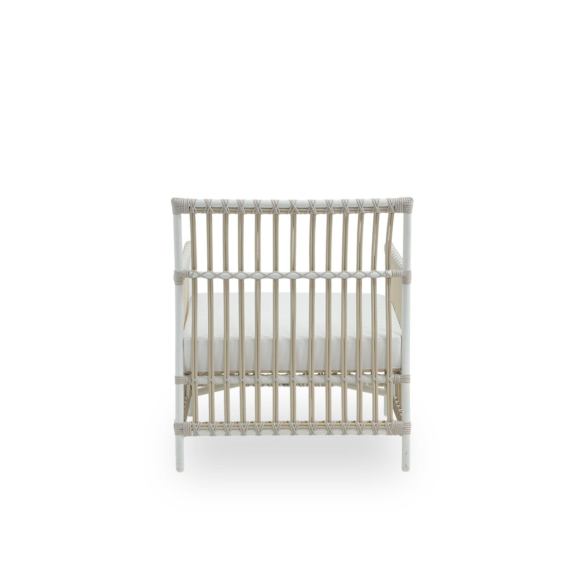 Plain back view of Caroline Exterior Lounge Chair in the color dove white, presented in simple and elegant Danish design. The frame of the chair is made from aluminum with elegant ArtFibre details. The chair has a cozy, calming presence.