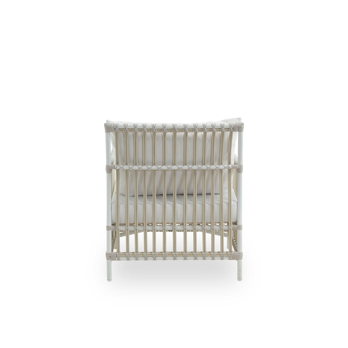 Plain back view of Caroline Exterior Lounge Chair in the color dove white, presented in simple and elegant Danish design. The frame of the chair is made from aluminum with elegant ArtFibre details. The chair has a cozy, calming presence.