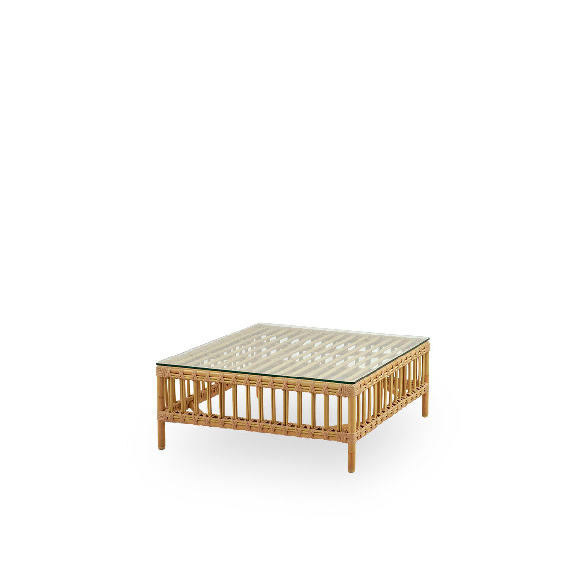 Side view of Maggie outdoor sofa pouf module in Natural color presented with glass top to be used as side table. Aluminium frame with handpainted rattan look with ArtFibre windings.