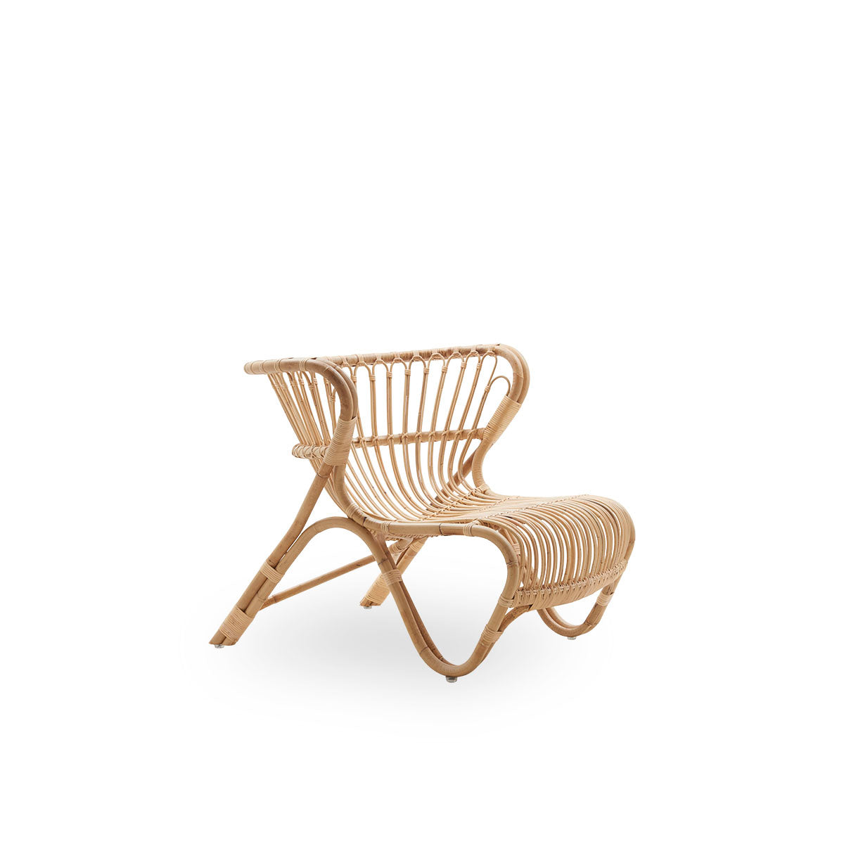 Side view of Fox lounge chair in natural rattan color designed by Viggo Boesen. Low curvy wicker lounge chair handcrafted from high-quality Indonesian rattan.