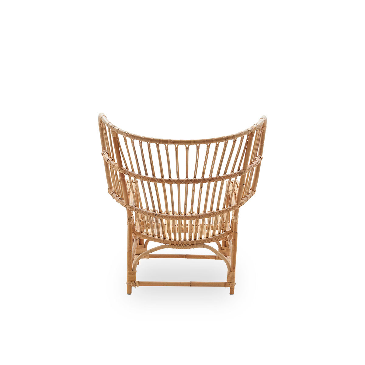 Side view of Teddy lounge chair by Viggo Boesen, big embracing lounge chair inspired by the 19th-century wing chair. Handcrafted from high quality Indonesian rattan