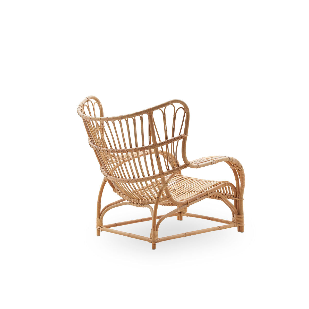 Plain back view of Teddy lounge chair by Viggo Boesen, big embracing lounge chair inspired by the 19th-century wing chair. Handcrafted from high quality Indonesian rattan.