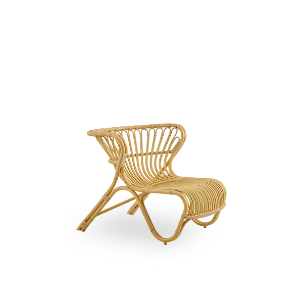 Side view of Fox Exterior lounge chair in natural rattan look, award-winning design by Viggo Boesen, low curvy lounge chair with hand-bent aluminium frame and ArtFibre windings.