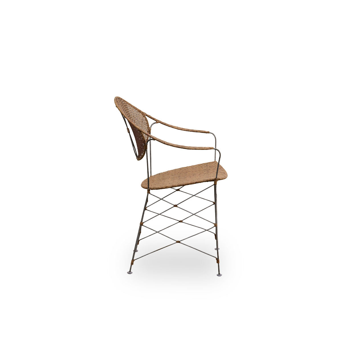 Plain side view of the Funky dining chair designed by Yuzuru Yamakawa. The chair has a steel frame with handwoven seat and backrest in high quality Indonesian rattan in Hazelnut color.