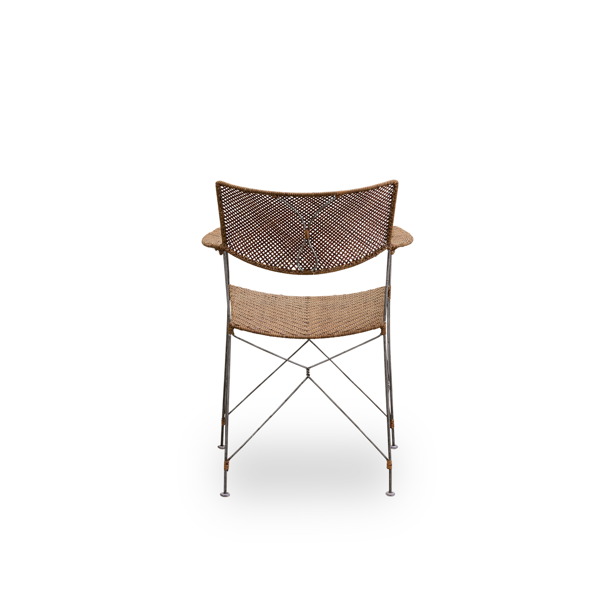 Plain back view of Rap dining chair designed by Yuzuru Yamakawa. Steel frame with seat and backrest handwoven with Indonesian rattan, lightweight chair combining Japanese design with traditional Indonesian craftsmanship.